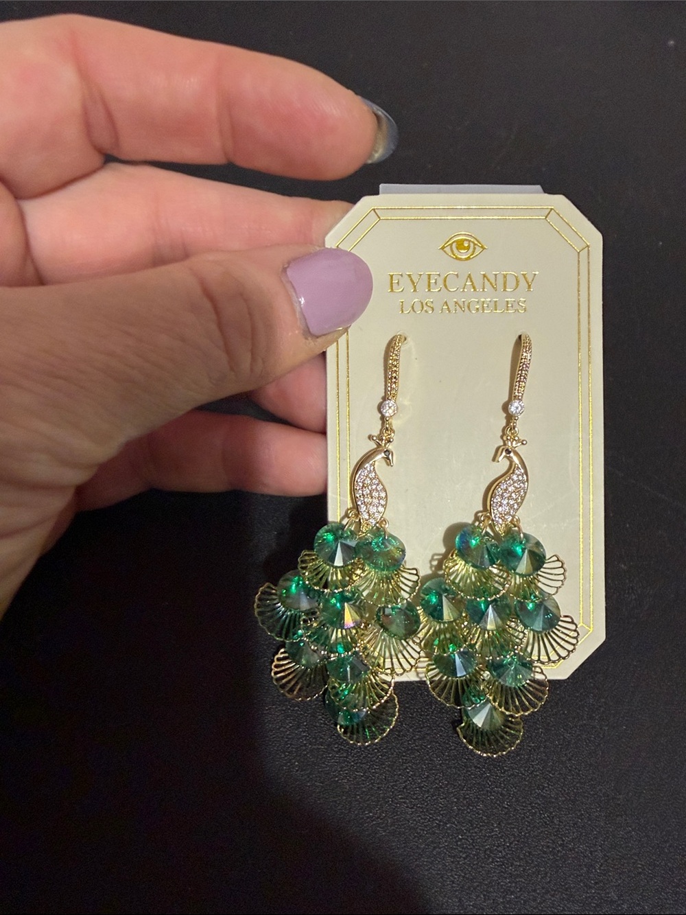 Eye candy gold crystal peacock dangle earrings